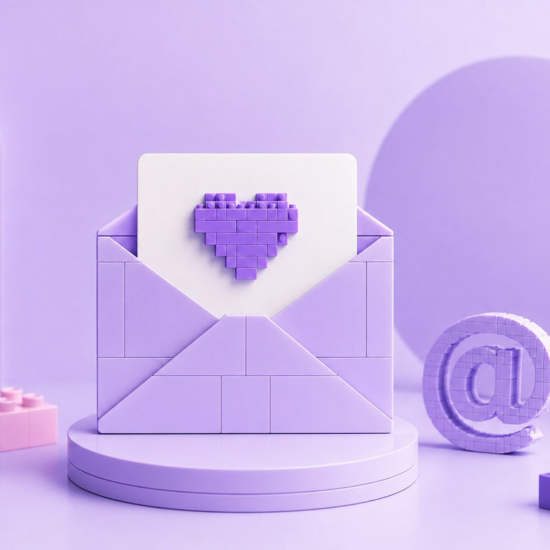 A brick-built envelope with a pixel heart, on a lilac podium beside a brick @ symbol